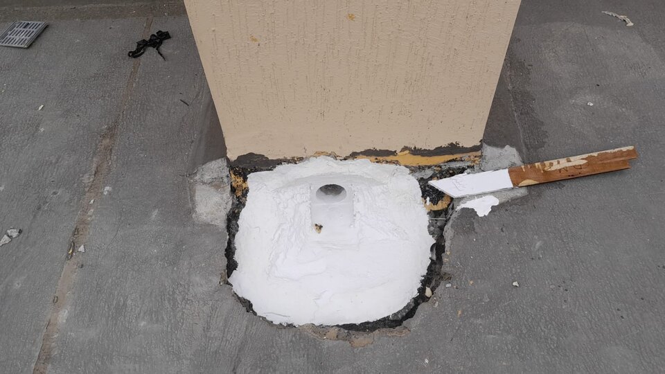 Drainage leak-repair detail at the base of a concrete column
