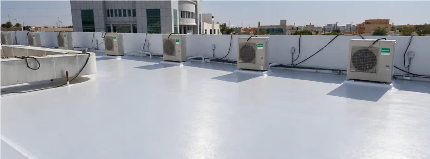 Wide view of a rooftop waterproofing surface and service elements