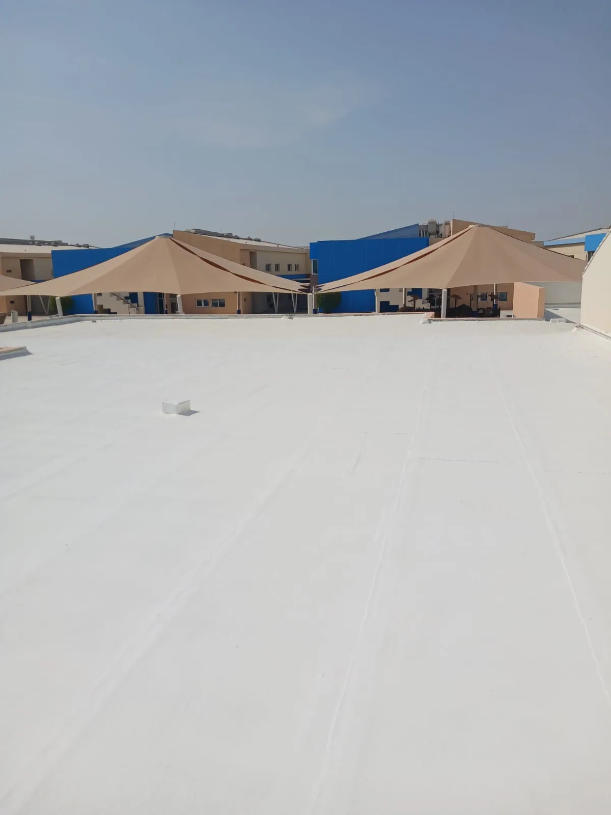 Rooftop surface and waterproofing details around service equipment