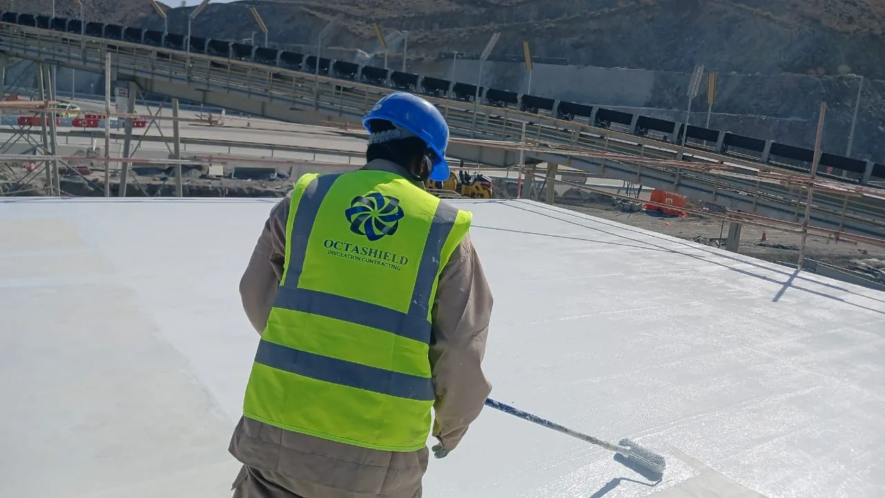 Octashield worker carrying out work across an exposed rooftop