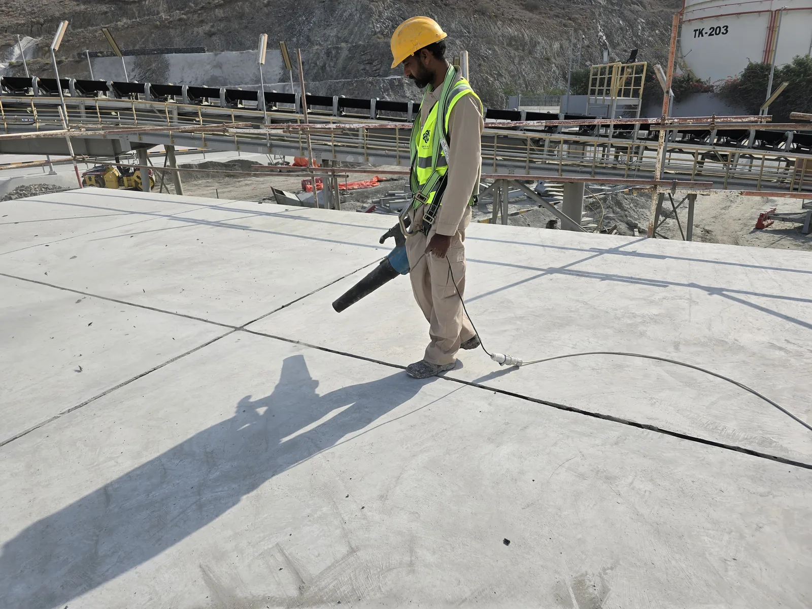 Worker carrying out application work on a rooftop
